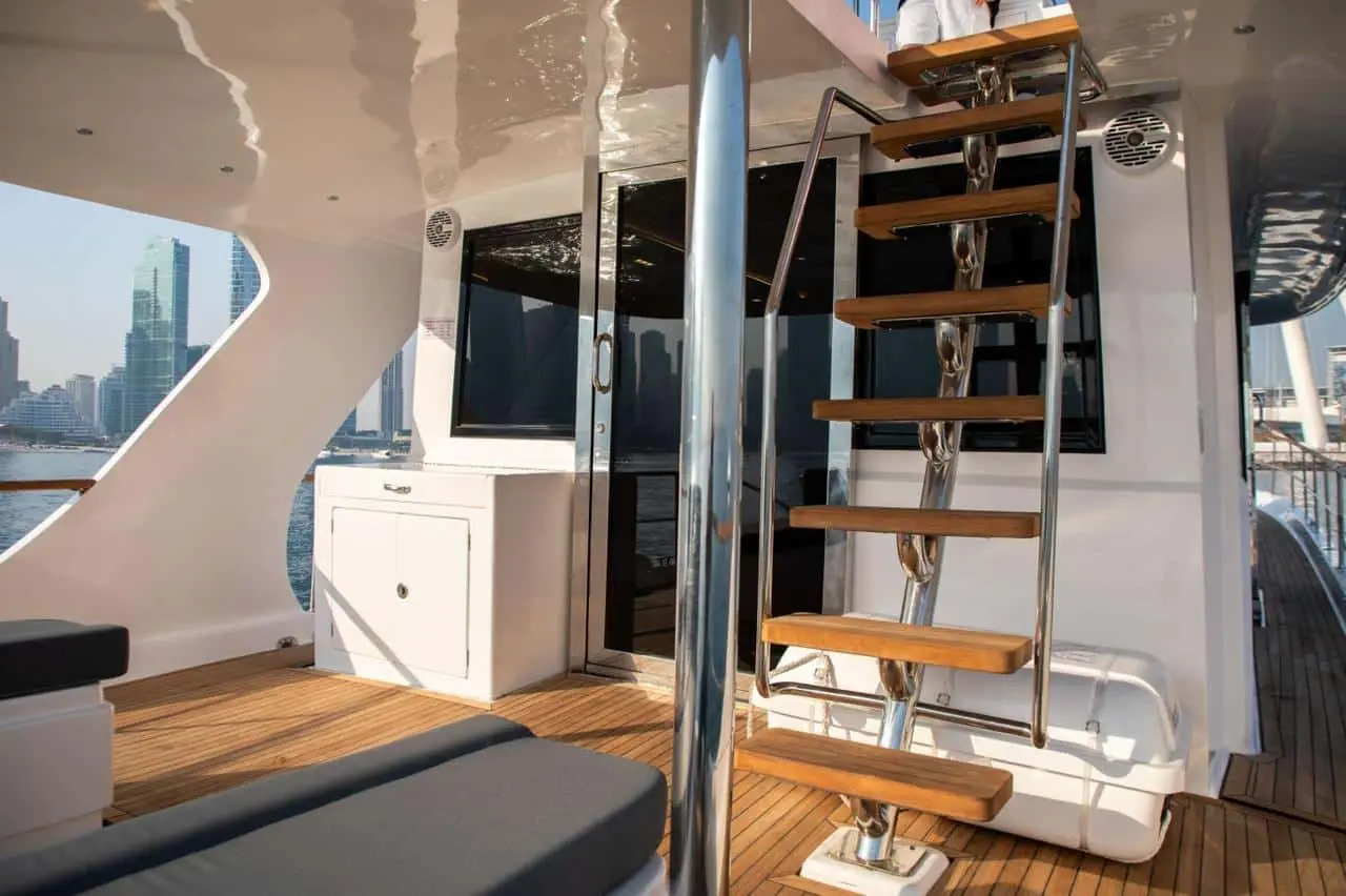Interior staircase and wooden finishes inside Zenith 64 yacht