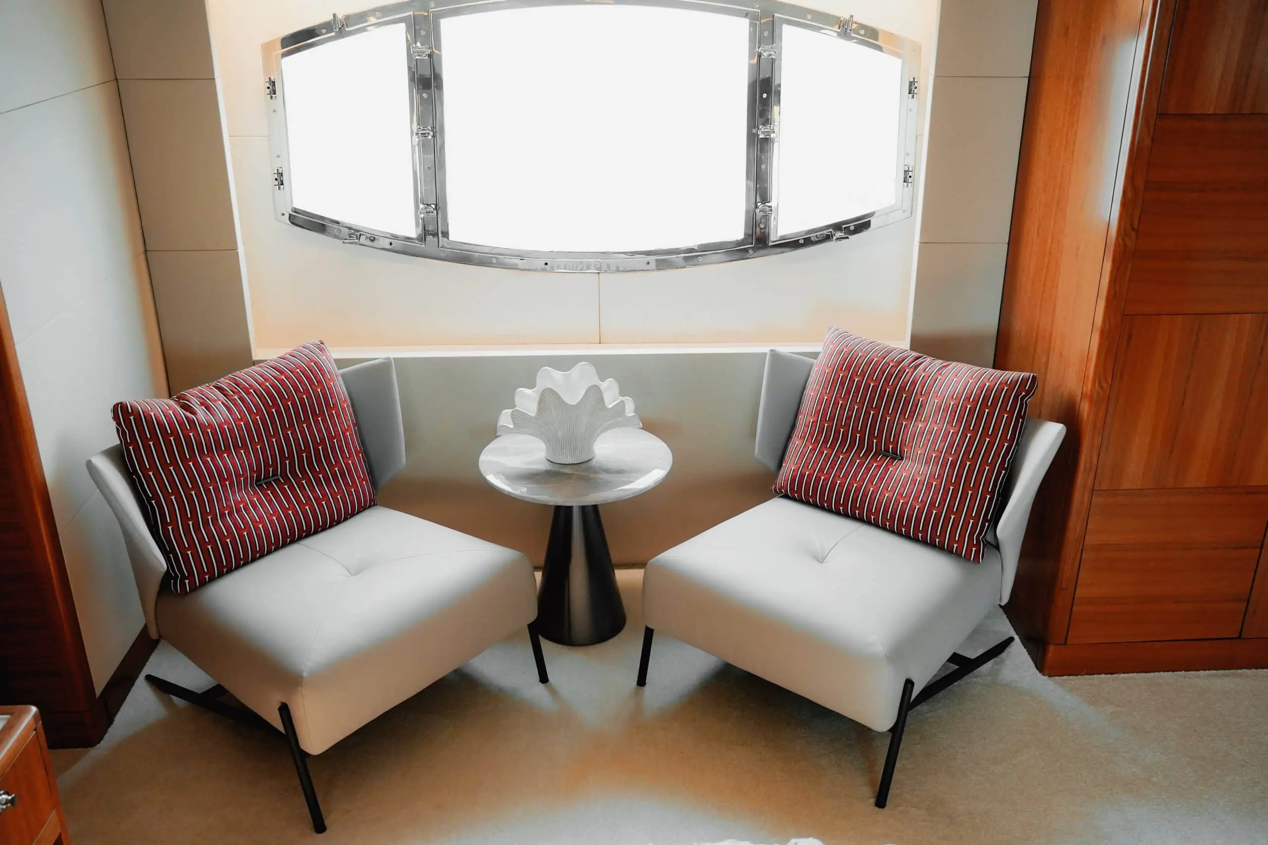 Luxury yacht Luna 101 cozy seating area with armchairs and marina view at Yas Marina Abu Dhabi