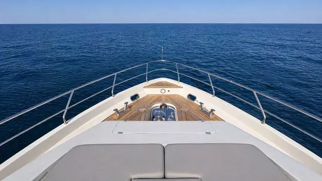 Azimut 88 view over the bow rail and teak foredeck at sea