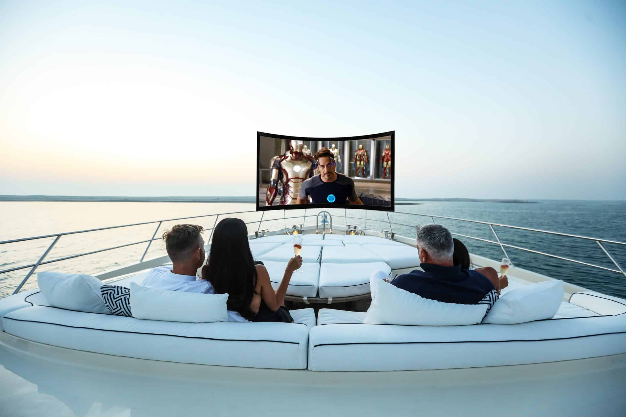 Outdoor lounge area with screen on Royalty 136 luxury yacht