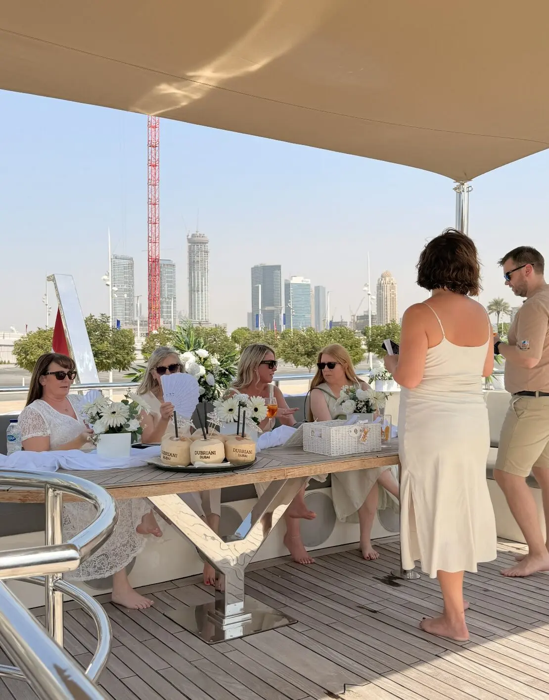 couple celebrating wedding event onboard luxury yacht with decorated setup