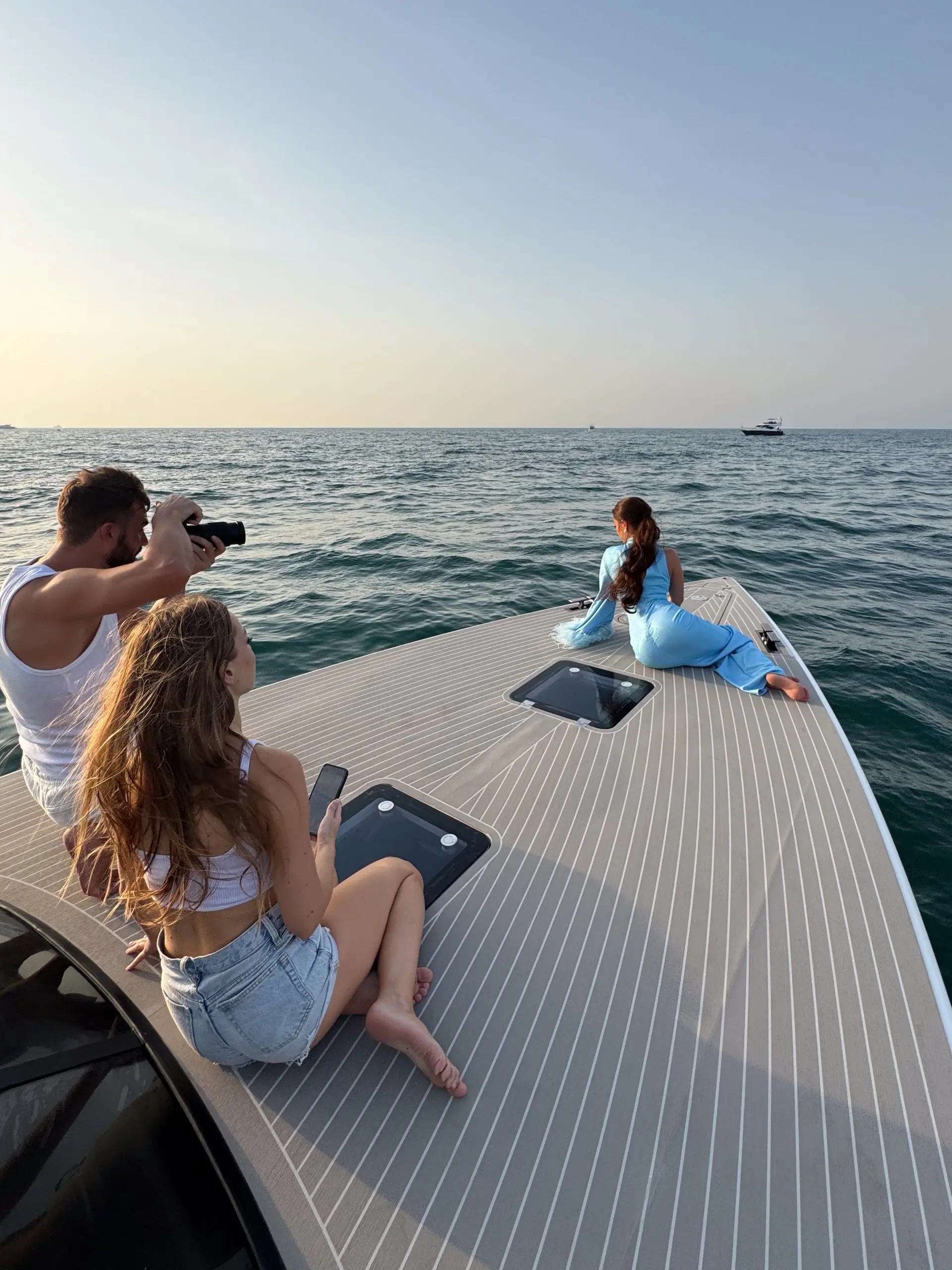 Von Dutch 40 bow sun deck with guests enjoying Dubai sea views