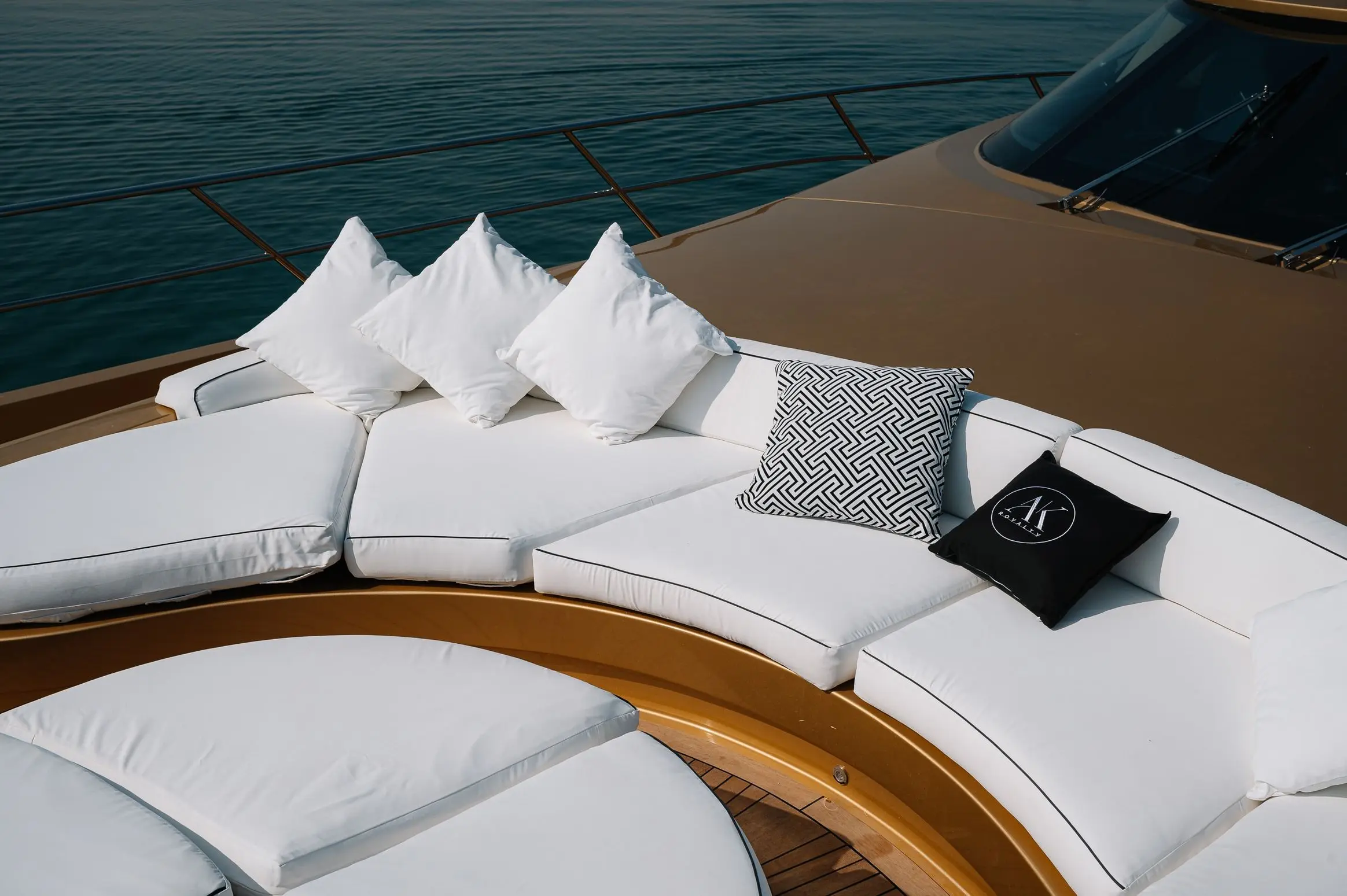 Luxury bow seating area with cushions on Royalty 136 yacht