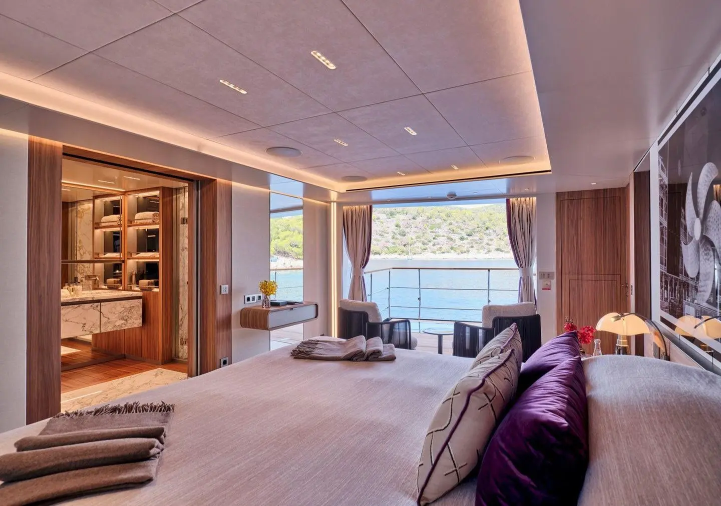 Sanlorenzo 500EXP owner suite with sea-view windows, broker photo