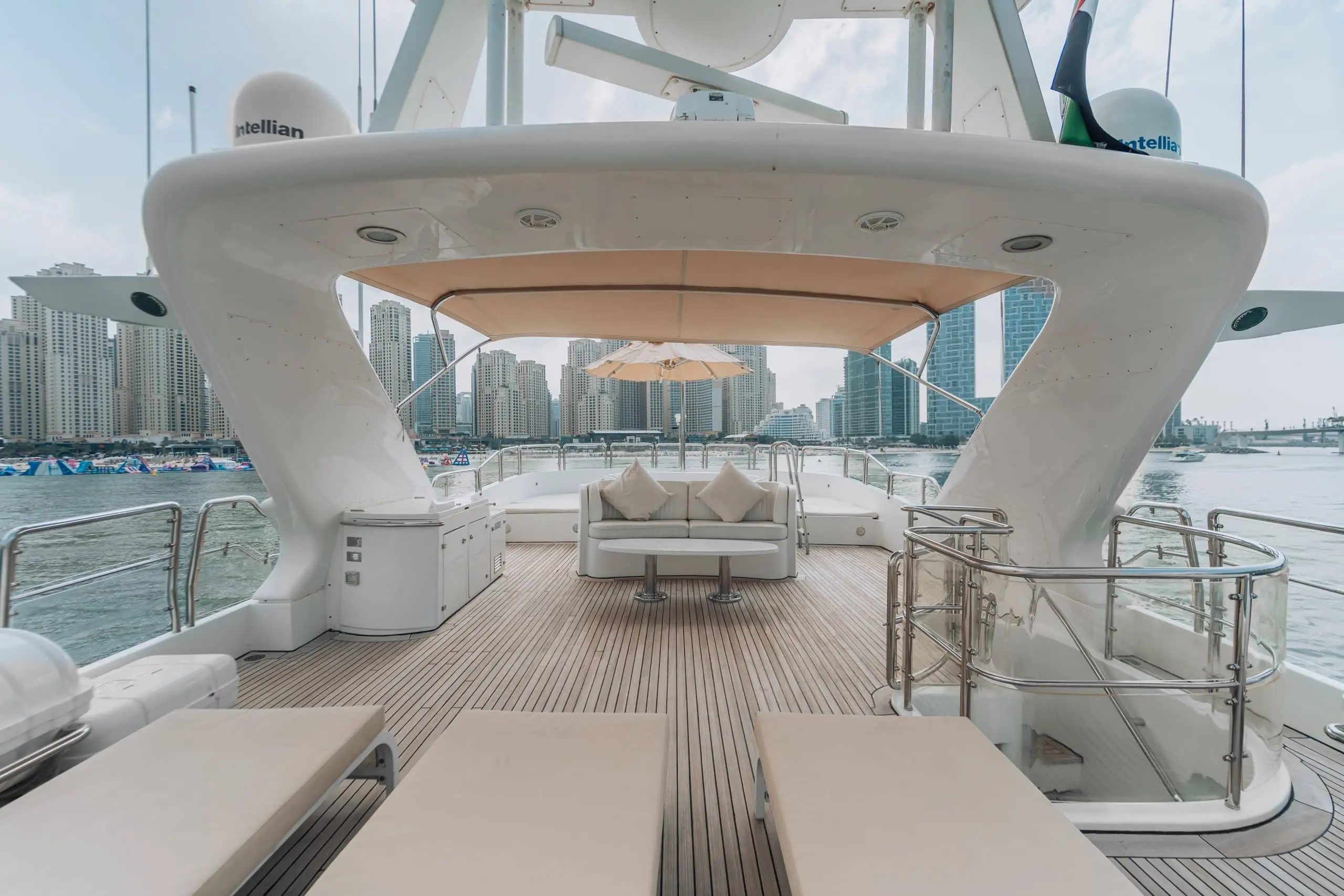 Luxury yacht lounge area with city skyline view.