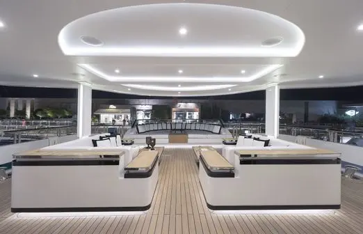 Skyfall 177 yacht main salon with curved sofas and modern ceiling design