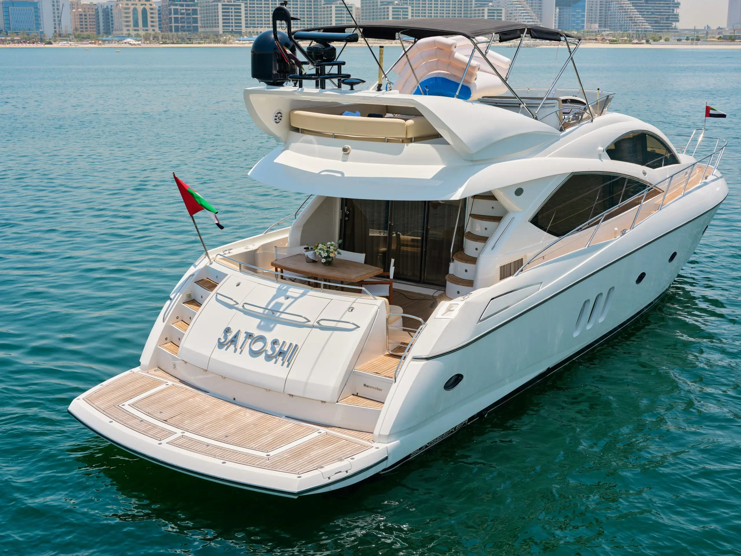 Sunseeker Satoshi 70 luxury yacht aft view cruising