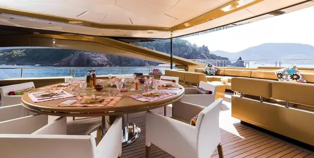 SuperSport 48 upper deck dining area set for al fresco meals