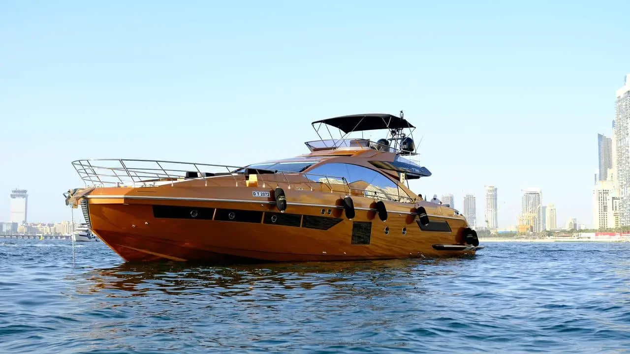 Azimut 77 luxury yacht exterior cruising in Dubai with skyline background