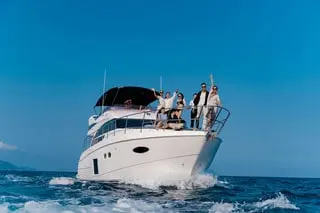 Group enjoying a luxury yacht experience in Dubai on a sunny day