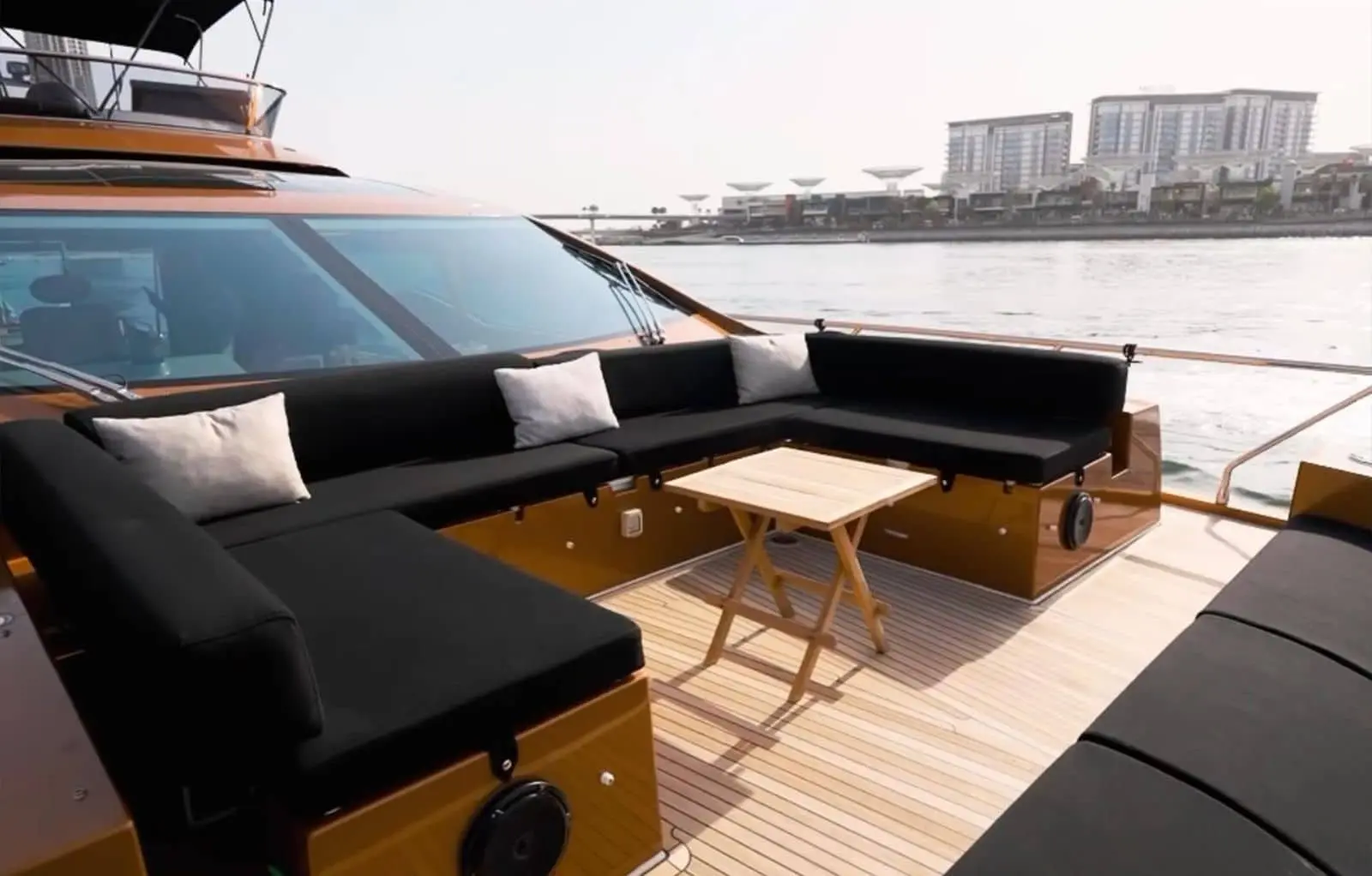 Azimut 77 yacht luxury deck seating area with waterfront skyline view