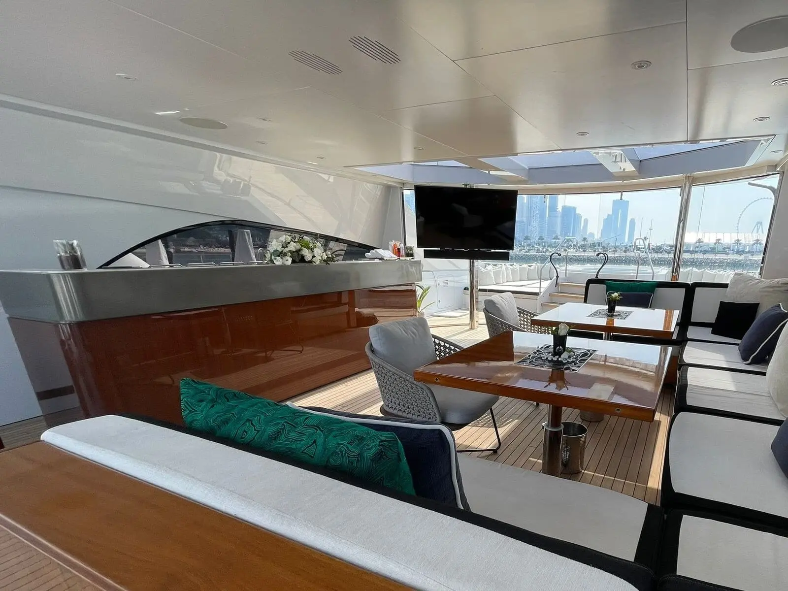Heesen 5000 sundeck bar and lounge with Dubai skyline views