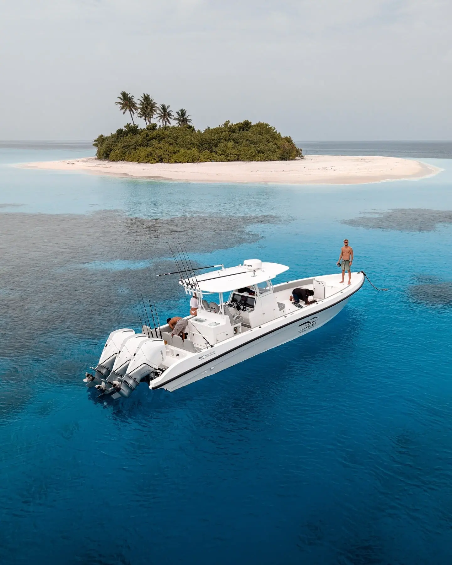 aerial view of luxury yacht cruising in clear blue ocean