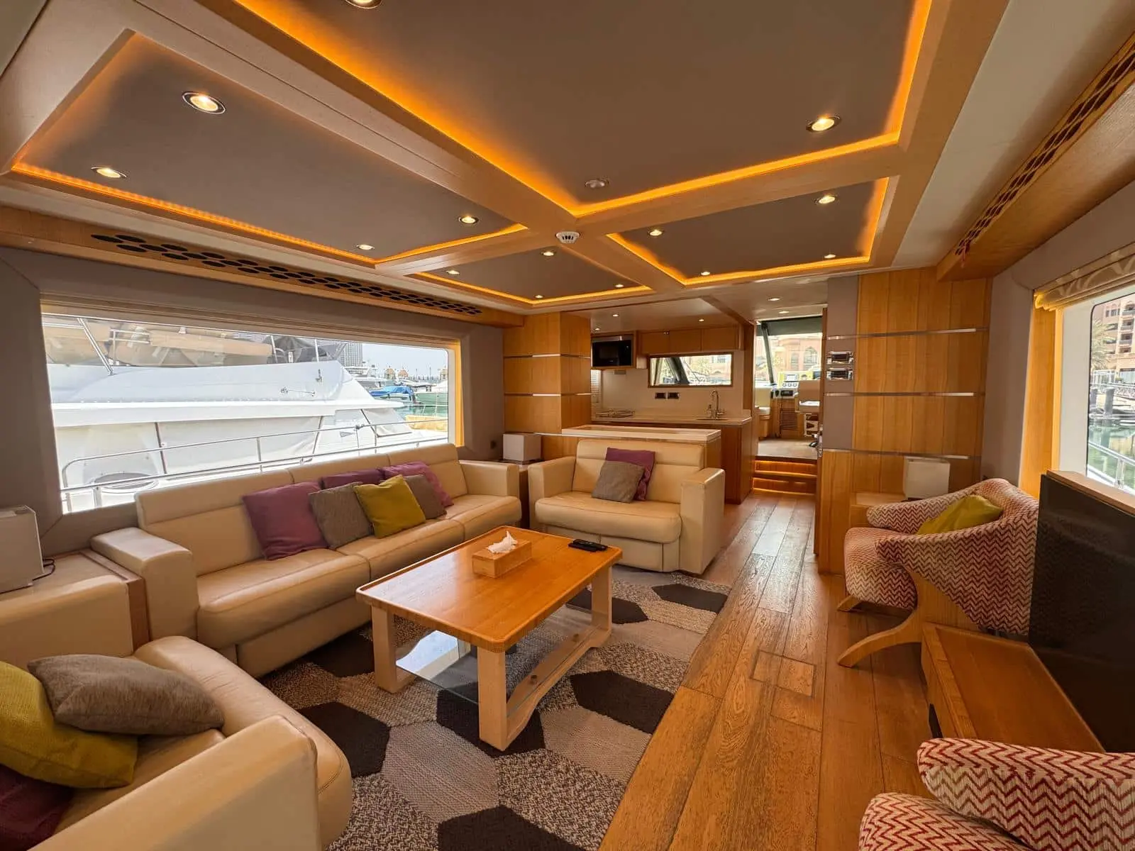 Nomad 65 saloon looking forward to the galley and lower helm