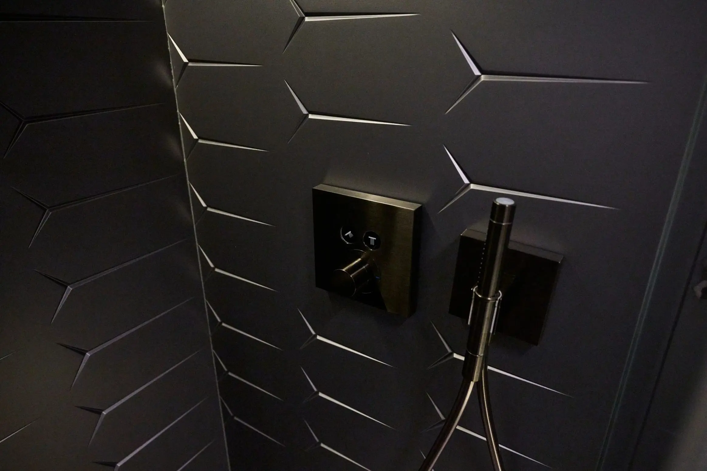 Lamborghini 63 yacht bathroom wall with geometric tile design and luxury fittings