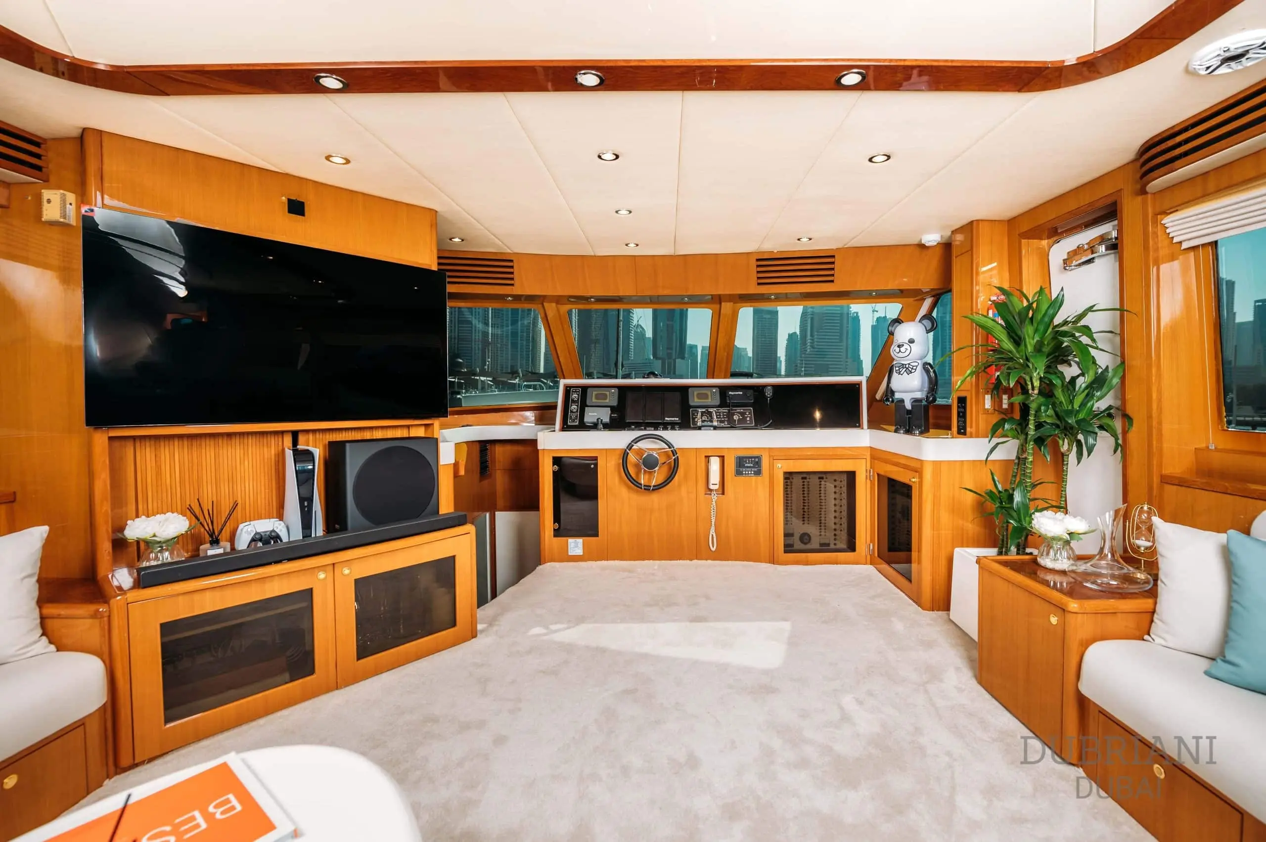 Panoramic lounge area inside Eclipse superyacht with floor-to-ceiling windows and plush seating
