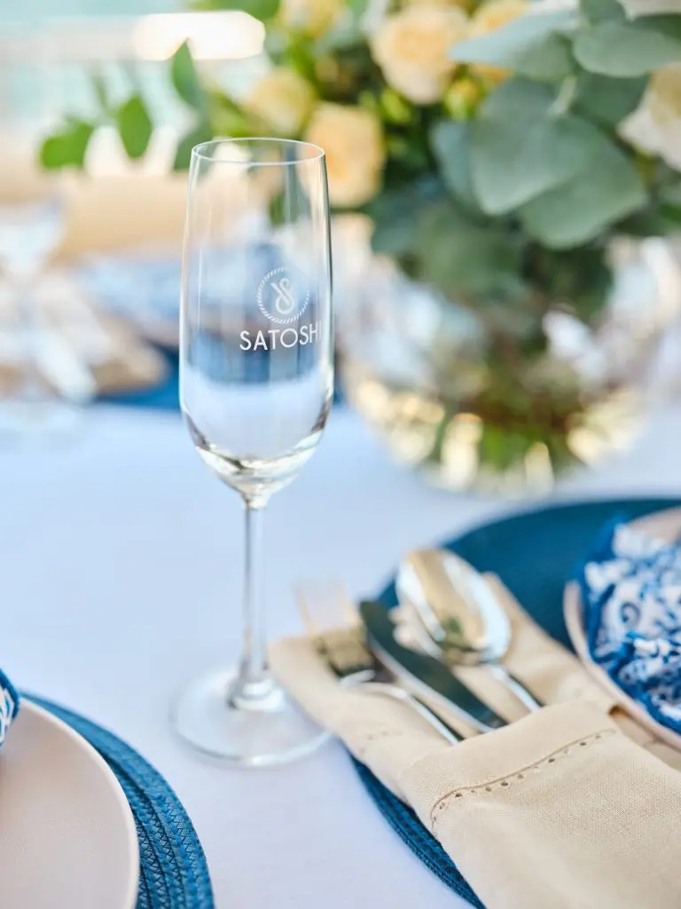 Champagne glass and luxury table setting on Sunseeker Satoshi 70 yacht