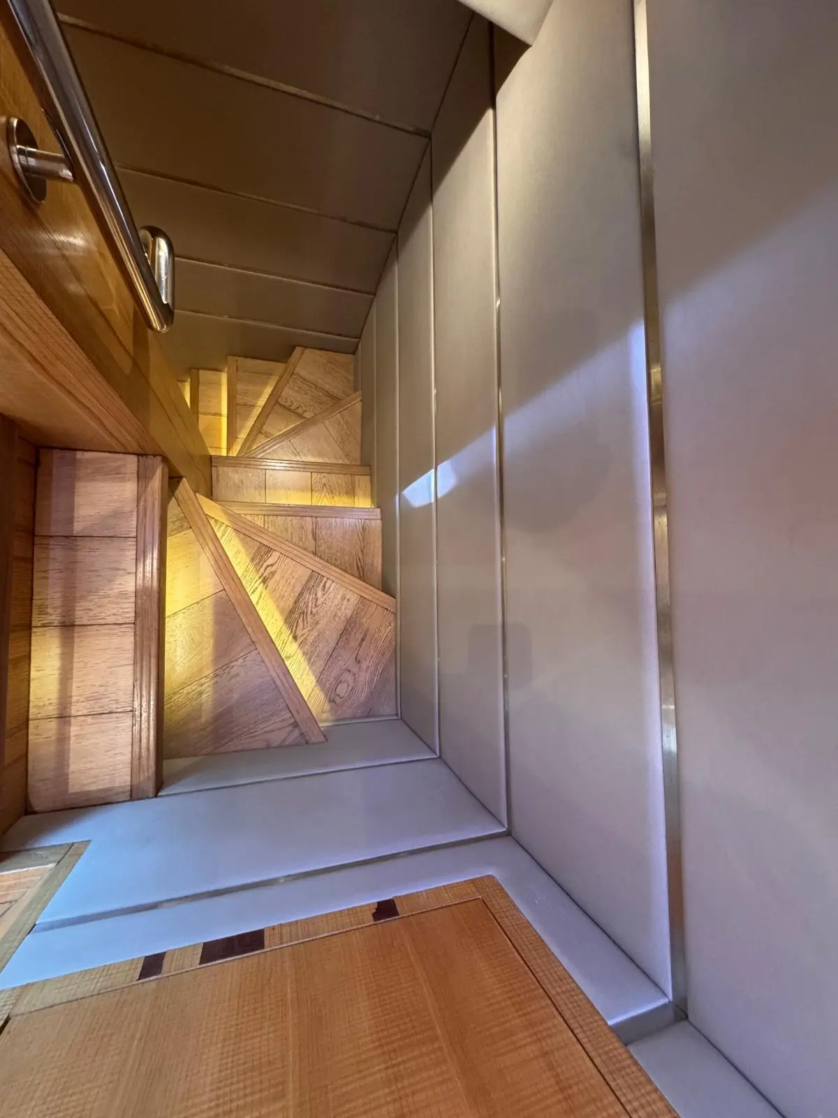 Nomad 65 companionway staircase down to the guest cabins