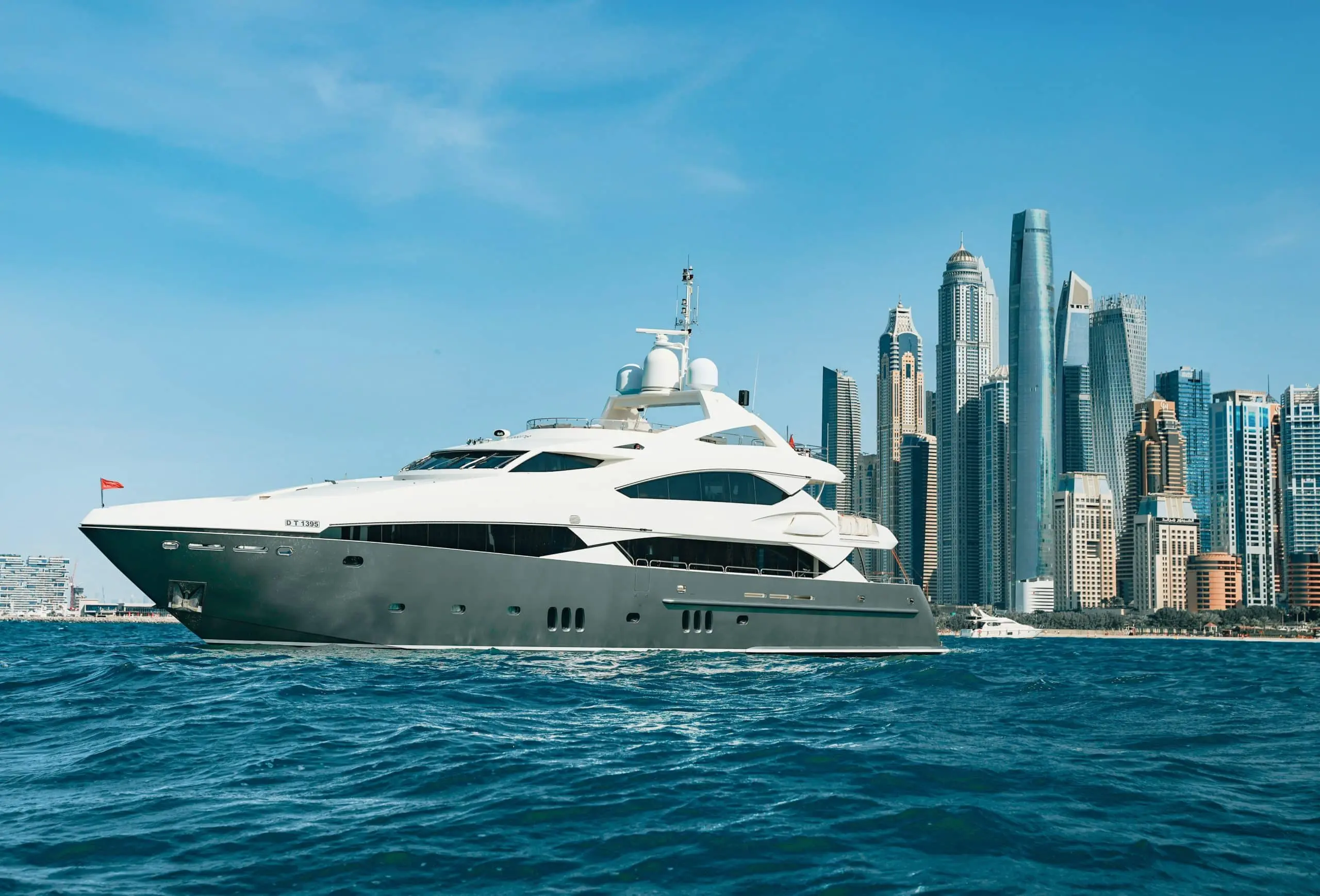 Aurora 130 yacht exterior profile near Dubai skyline