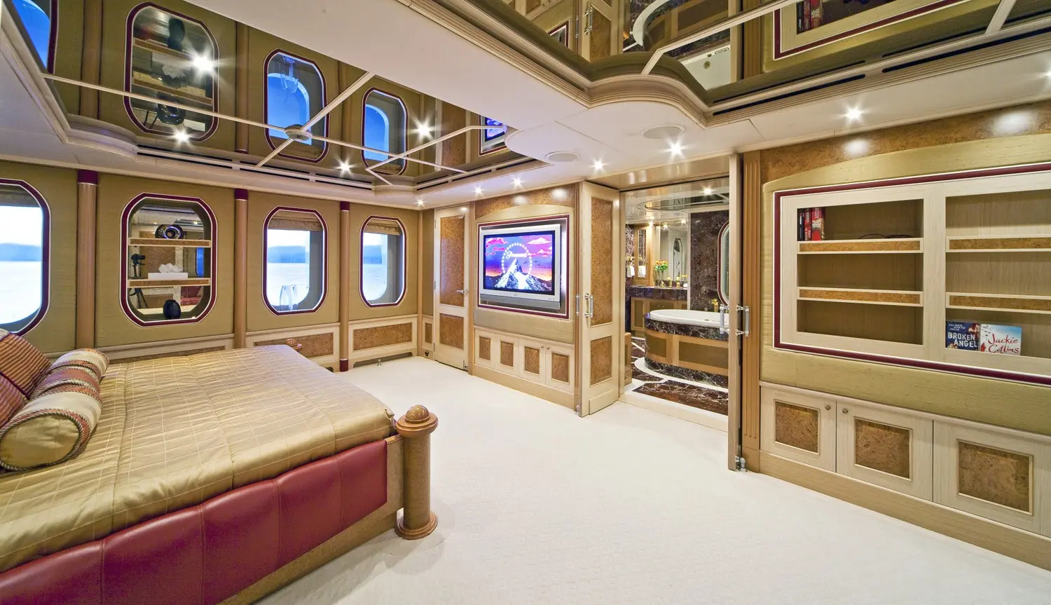 Athena 170 yacht entertainment lounge with large screen and plush seating
