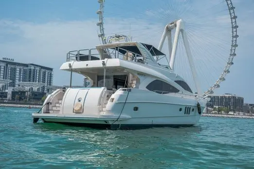 Cabo 77 private luxury yacht side view docked in Dubai Marina