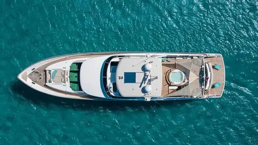 Aerial top view of Zeta 100 yacht deck layout in turquoise Dubai waters