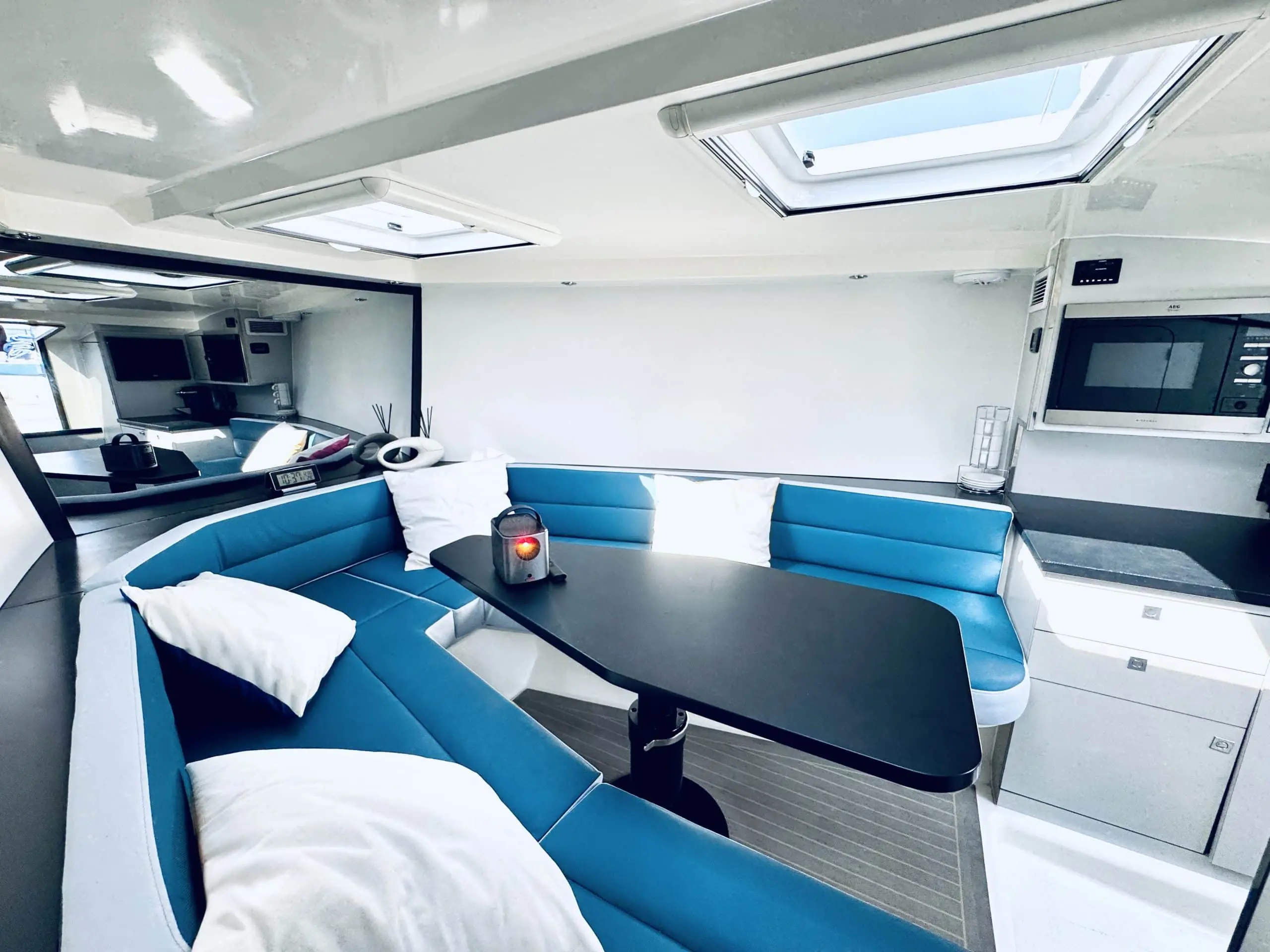 Von Dutch 40 interior lounge with blue seating and skylight