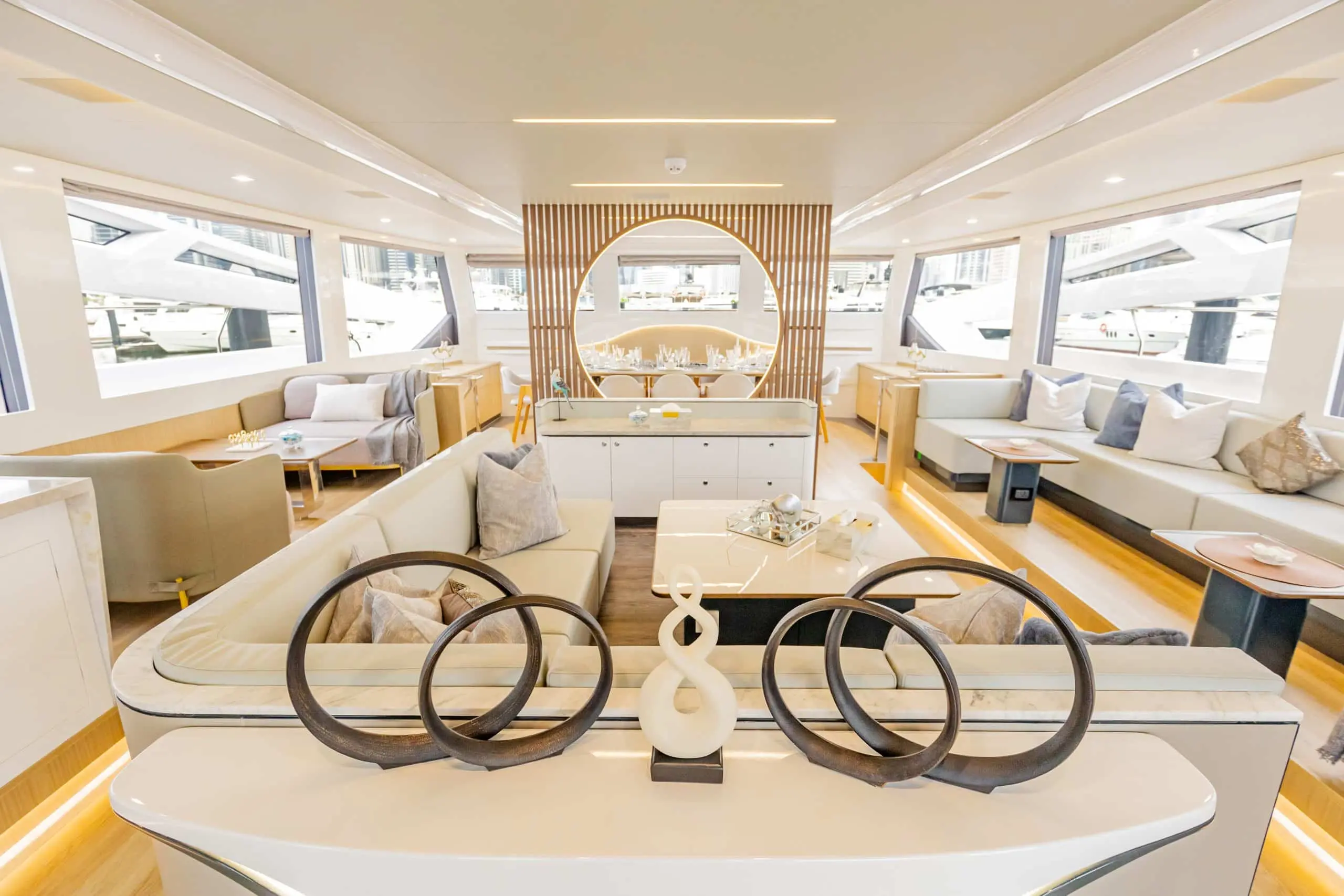 Zirve 72 luxury yacht main saloon with panoramic windows and modern U-shaped seating area