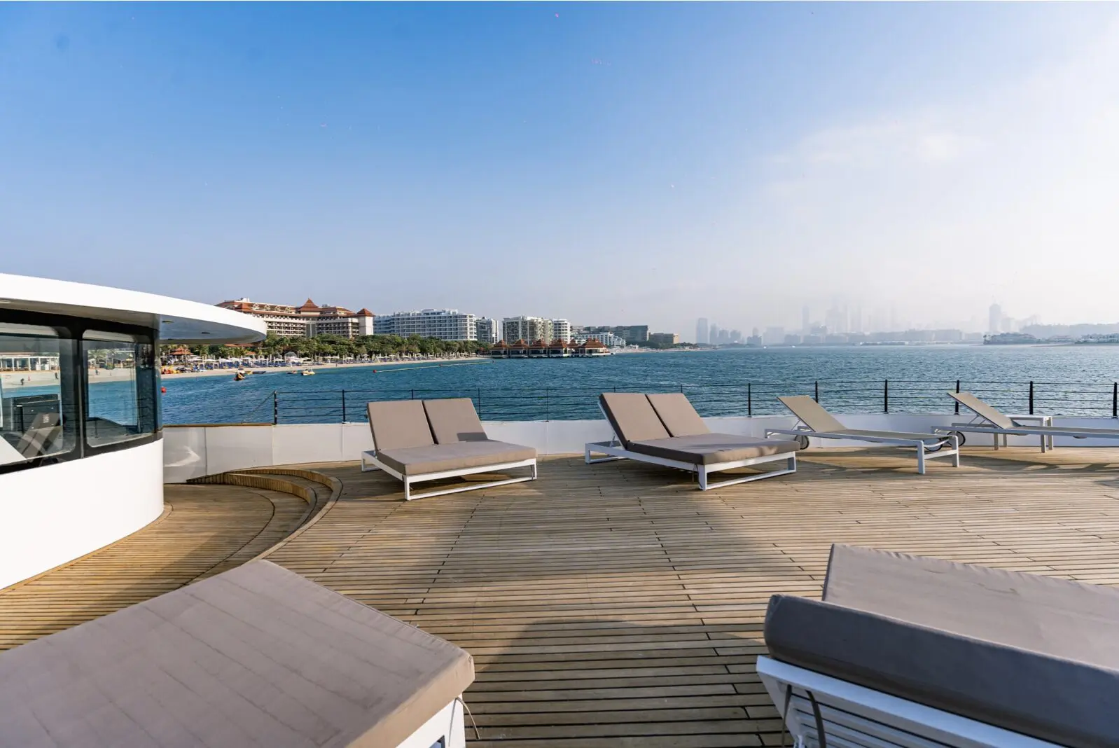 Finesse yacht sun deck lounge chairs overlooking Dubai Marina skyline