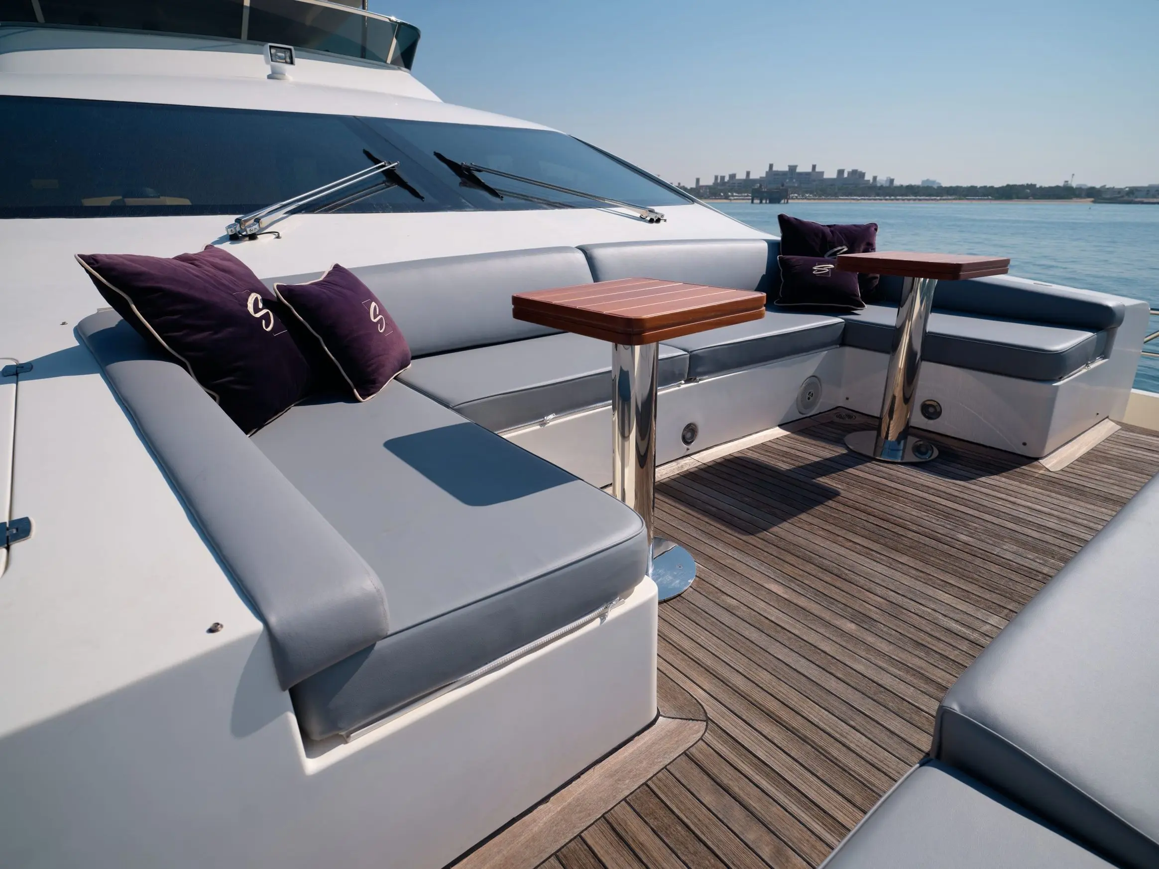 Comfortable sunbathing area with cushions on Azimut 88 yacht