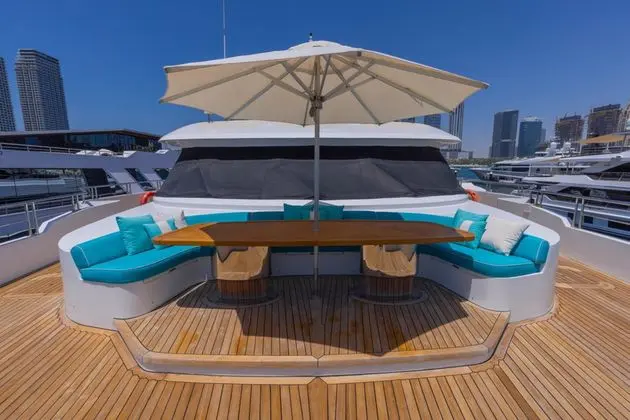 Majesty 155 bow lounge with dining table and umbrella, broker photo