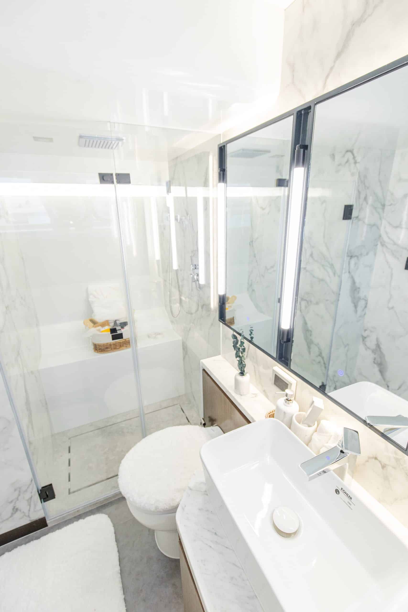 Modern marble bathroom of Zirve 72 motor yacht with walk-in shower