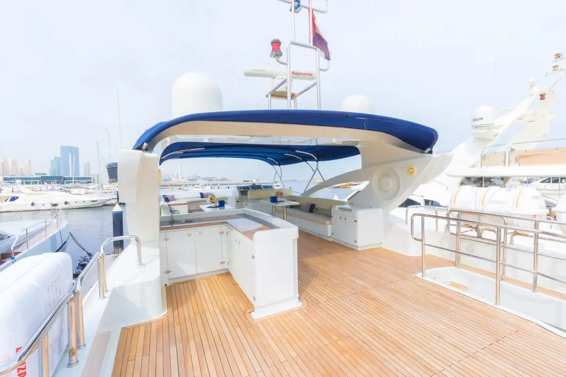 Asya 110 yacht upper deck helm station with seating area