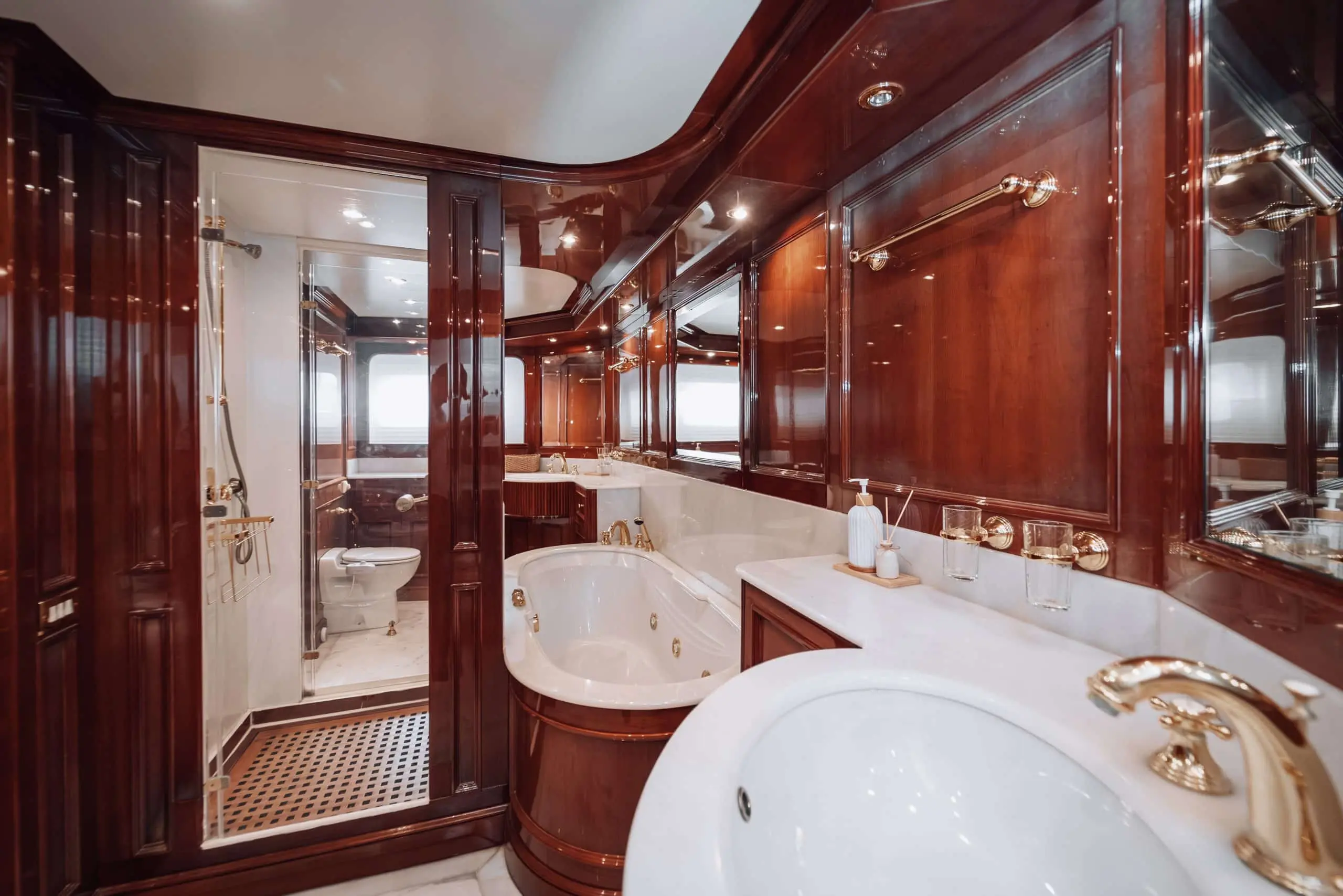 Royal Mirage yacht formal dining area with round wooden table and seating