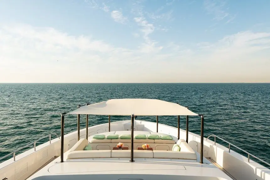 Heesen 5000 foredeck sunpads shaded by a canopy at anchor