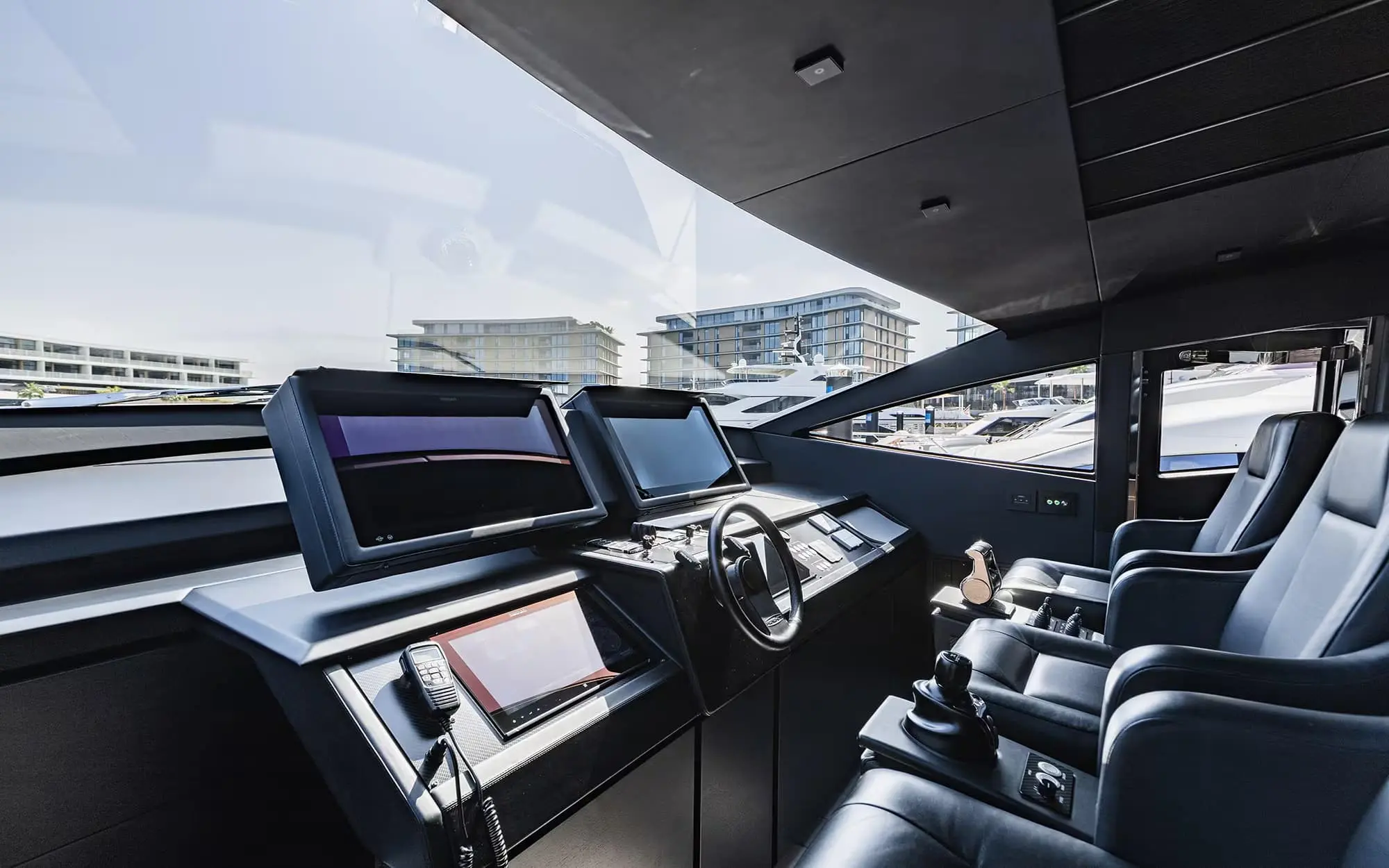 Pershing 8X helm station with triple navigation screens