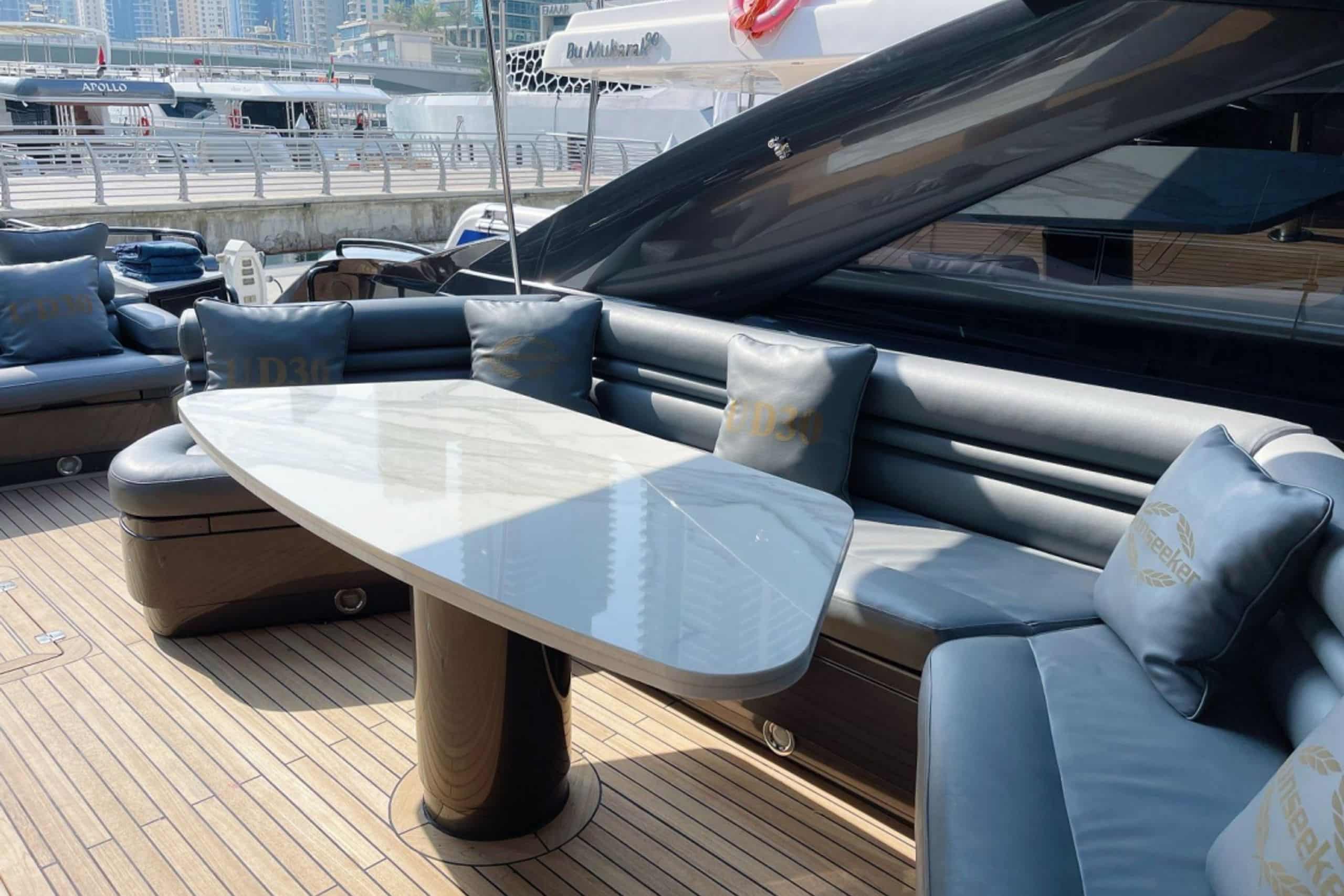 Black Predator 95 Sunseeker yacht aft deck dining area
