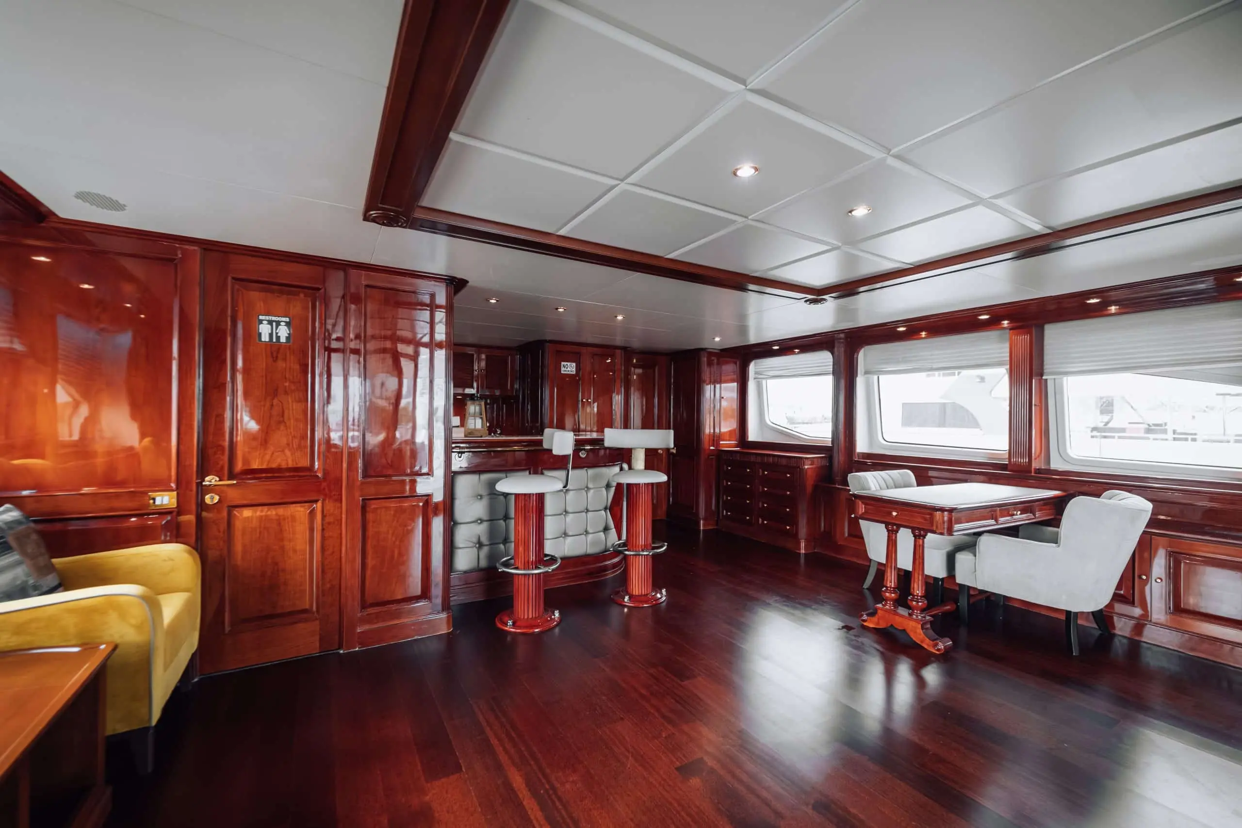 Royal Mirage yacht kitchen and dining layout with luxury wood finishes