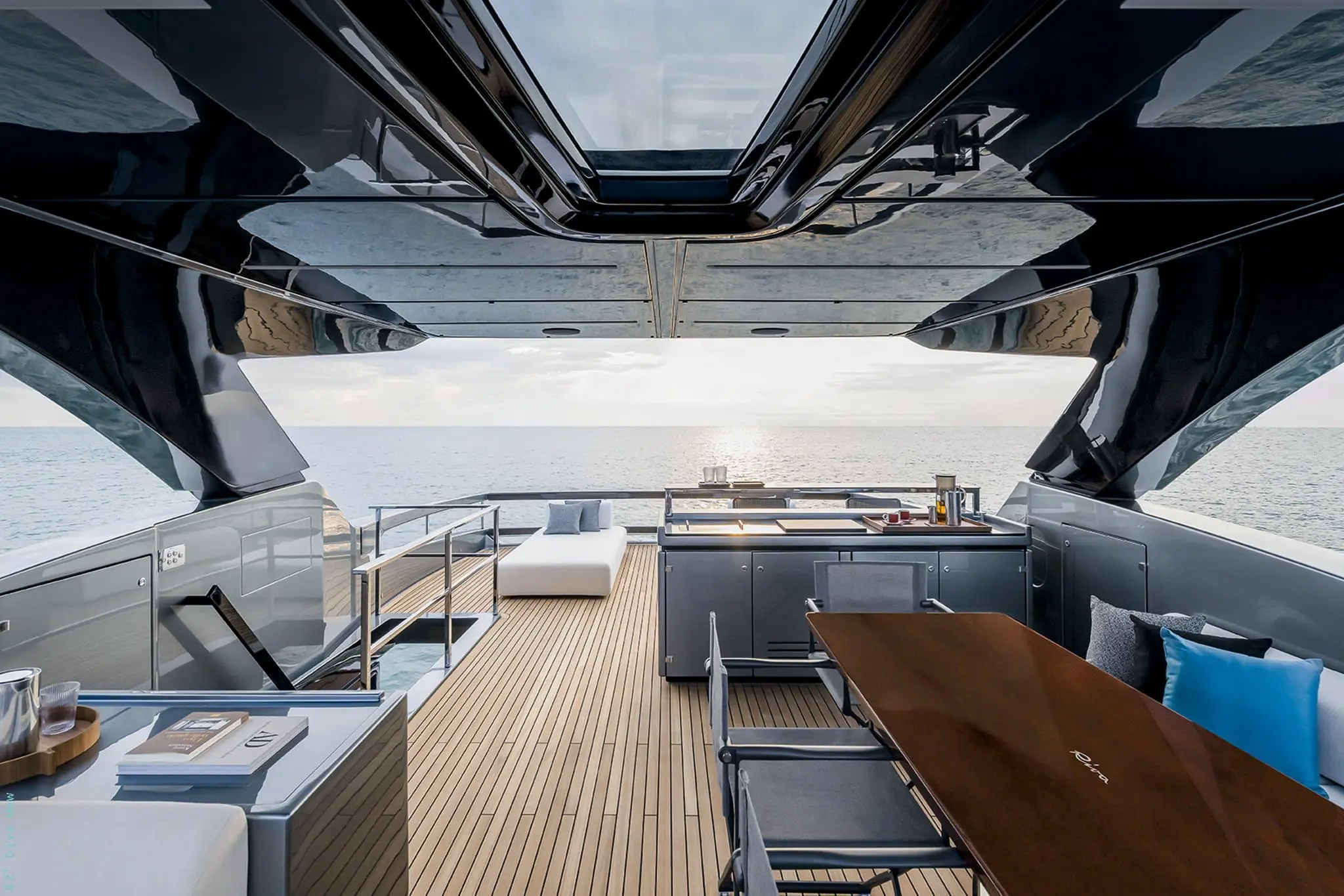 Riva 82 Diva flybridge bar counter and dining table under hardtop
