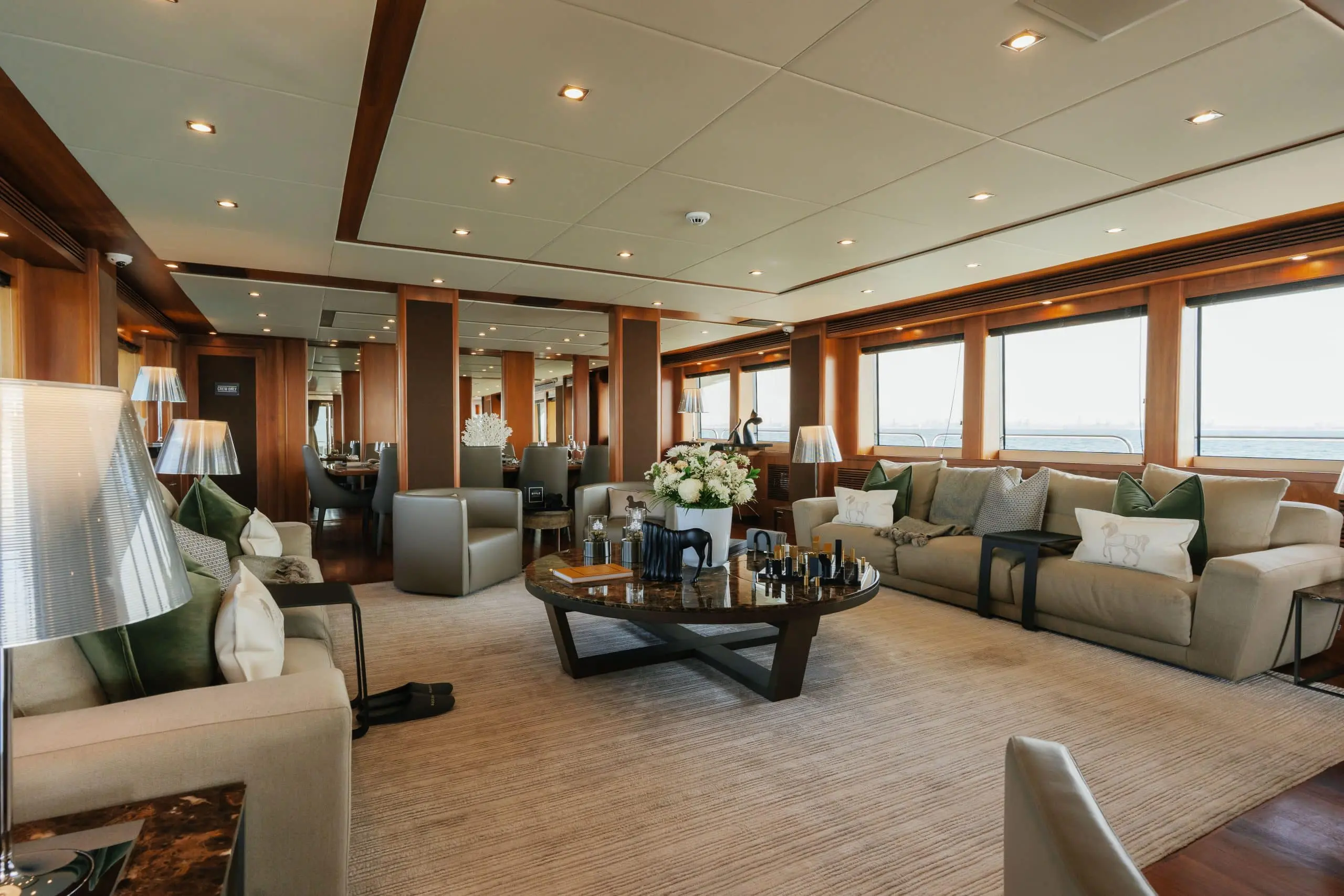 Aurora 130 yacht main salon with luxury seating and panoramic windows