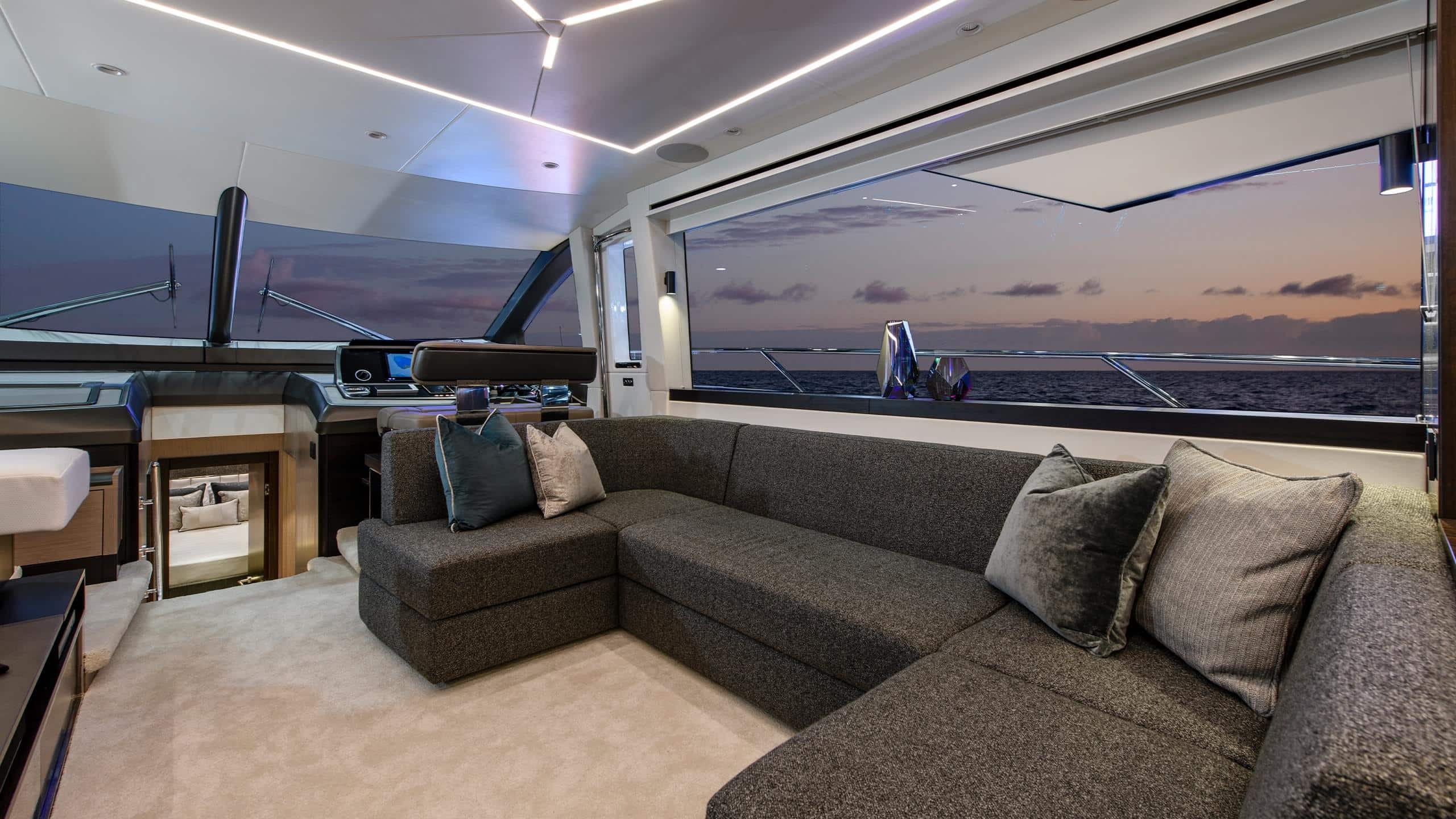 Sunseeker Manhattan 68 saloon lounge seating at dusk — shipyard photo