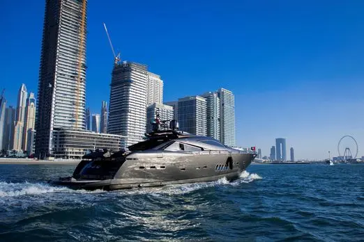 Black Predator 95 Sunseeker yacht running at speed off Dubai coast