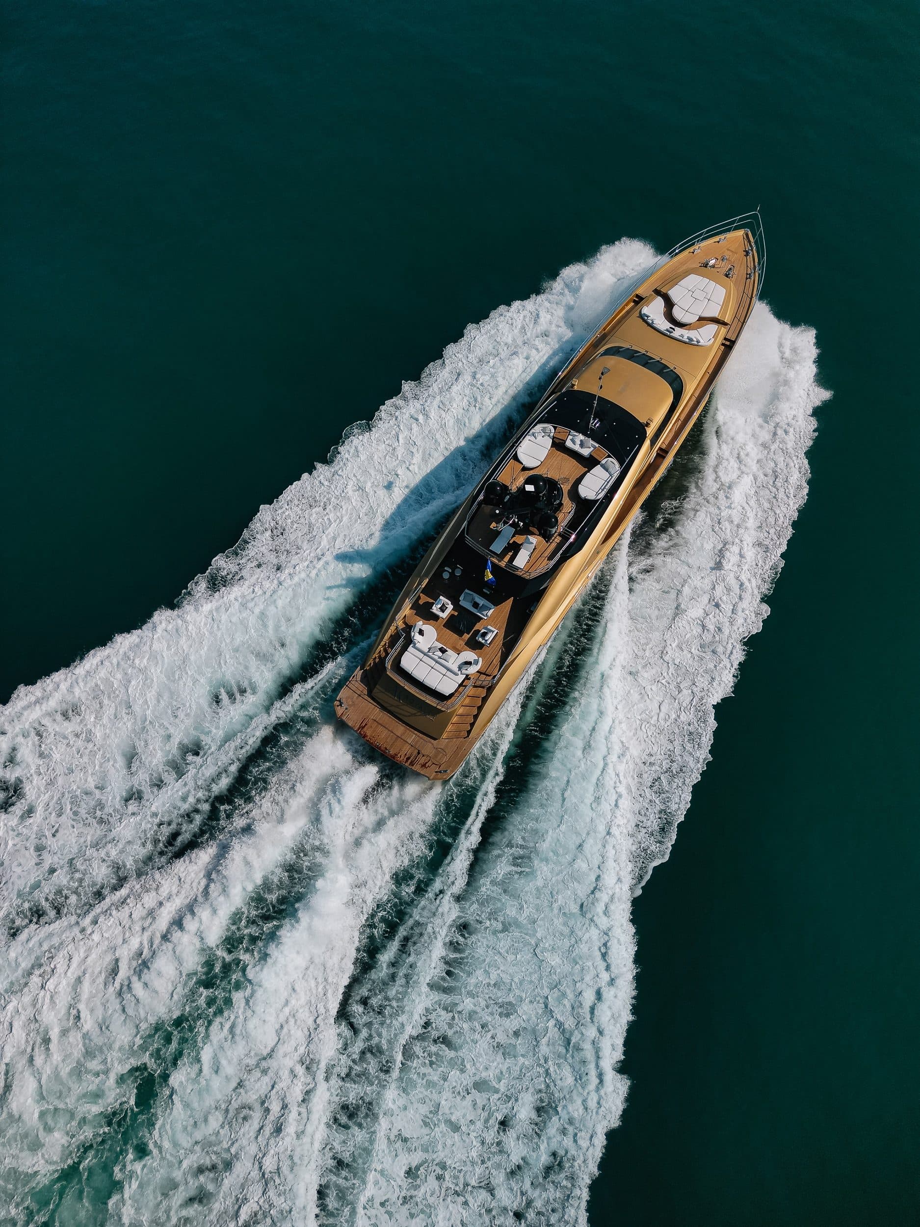 Top aerial view of Royalty 136 luxury yacht cruising at high speed