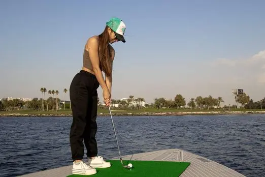 Von Dutch 40 yacht deck activity with Dubai skyline background