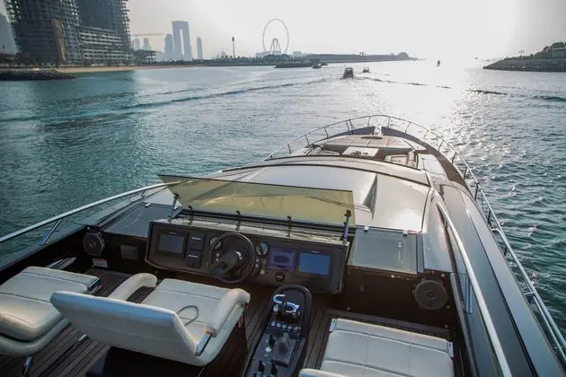 Pershing 82 sun deck helm and seating underway off Dubai