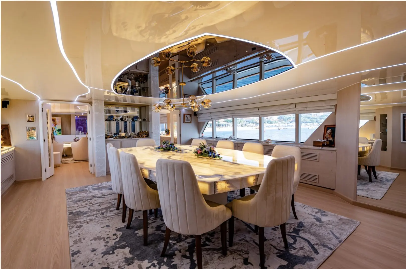 Luxury yacht upper deck dining table with panoramic Dubai views