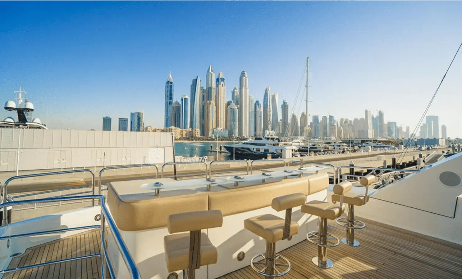 Sunseeker 40M sky deck bar with stools facing Dubai skyline