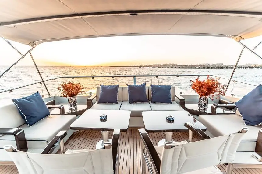 Baglietto 105 HT aft deck sofas and tables at sunset, Dubai