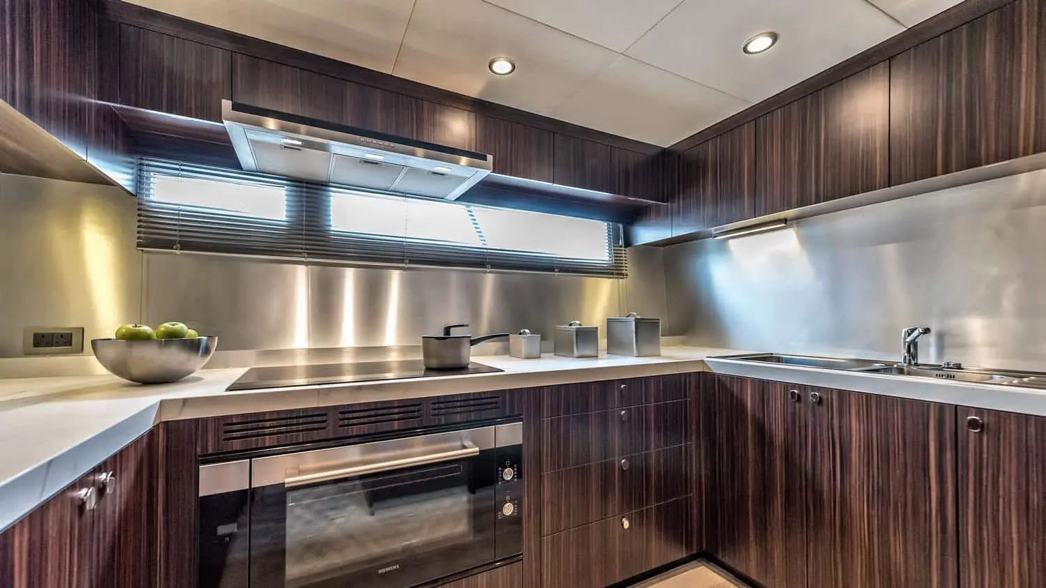 Dolce Vita yacht fully equipped galley kitchen with stainless steel appliances in Dubai