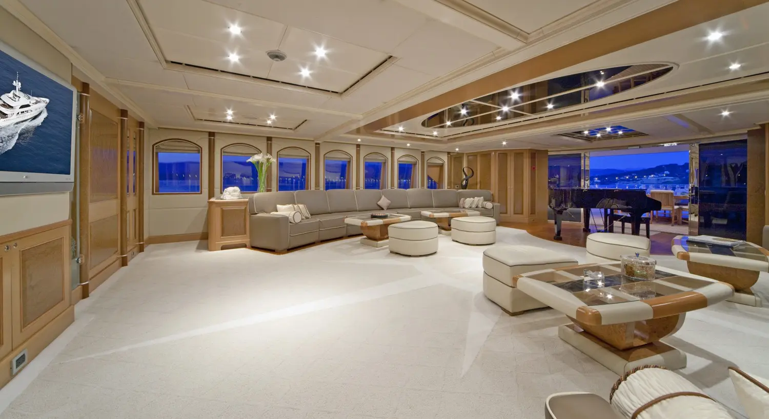 Athena 170 yacht main salon with modern seating and large windows
